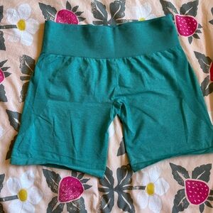 NVGTN teal shorts